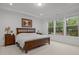 Serene bedroom with large windows and neutral decor at 1104 Covered Bridge Trl, Chapel Hill, NC 27517
