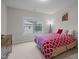 Charming bedroom with a cozy bed, soft carpet, and a large window creating a comfortable and relaxing space at 1104 Covered Bridge Trl, Chapel Hill, NC 27517
