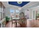 Dining room with hardwood floors, a window view, and decorative elements at 1104 Covered Bridge Trl, Chapel Hill, NC 27517