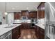 Gourmet kitchen with stainless steel appliances, marble counters, and stylish fixtures at 1104 Covered Bridge Trl, Chapel Hill, NC 27517