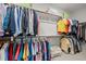 Spacious walk-in closet providing ample storage with multiple shelves and hanging rods for organization at 1104 Covered Bridge Trl, Chapel Hill, NC 27517