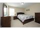 Comfortable bedroom with a large bed, side tables, and ample storage with dressers at 1209 Redwood Valley Ln, Knightdale, NC 27545