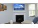 Close up of the fireplace in the living room, including TV and decorations on the wall at 1209 Redwood Valley Ln, Knightdale, NC 27545