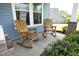 Cozy front porch featuring wooden rocking chairs, offering a relaxing outdoor space with neighborhood views at 1209 Redwood Valley Ln, Knightdale, NC 27545