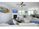 Living room featuring a fireplace, large TV, and comfortable sectional couch with blue accents at 1209 Redwood Valley Ln, Knightdale, NC 27545