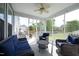 Cozy screened porch with comfortable seating, a ceiling fan, and a view of the backyard at 1209 Redwood Valley Ln, Knightdale, NC 27545