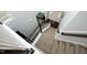 Carpeted staircase with white railings and dark wood accents, leading to the entryway at 1209 Redwood Valley Ln, Knightdale, NC 27545