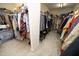 Spacious walk-in closet with ample shelving, hanging space, and neatly organized clothing and shoes at 1209 Redwood Valley Ln, Knightdale, NC 27545