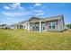 A large, well-maintained backyard with a covered patio, perfect for outdoor living and entertaining in a community setting at 1316 London Meadow Way, Fuquay Varina, NC 27526