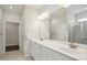 Bathroom features double sinks, a shower, and a linen closet at 1316 London Meadow Way, Fuquay Varina, NC 27526