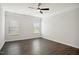 Spacious bedroom featuring hardwood flooring, crown molding, and a ceiling fan at 1316 London Meadow Way, Fuquay Varina, NC 27526