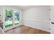 Bright breakfast nook features a large window overlooking the backyard and hardwood floors at 1412 Amberton Ct, Raleigh, NC 27615