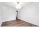 Bright dining room featuring hardwood floors, updated lighting, and fresh white paint at 1412 Amberton Ct, Raleigh, NC 27615