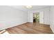 Neutral room with beautiful wood flooring and bright, natural light streaming in at 1412 Amberton Ct, Raleigh, NC 27615