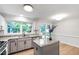 Bright kitchen offers granite countertops, an island, and stainless steel appliances at 1412 Amberton Ct, Raleigh, NC 27615