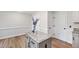 Kitchen island features granite countertops, updated appliances, and hardwood floors at 1412 Amberton Ct, Raleigh, NC 27615