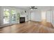 The living room has a cozy fireplace, wood floors, and a large window at 1412 Amberton Ct, Raleigh, NC 27615