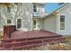 Back exterior view with spacious deck and ample natural light shining on the light vinyl siding at 145 Richmond Park Dr, Cameron, NC 28326
