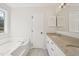 Bright bathroom with granite countertops, double sinks, a tub, and natural light at 145 Richmond Park Dr, Cameron, NC 28326