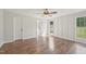 Well-lit bedroom boasts a ceiling fan and a view of the backyard at 145 Richmond Park Dr, Cameron, NC 28326