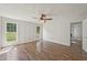 Bedroom featuring two windows, a ceiling fan, and wood-look floors at 145 Richmond Park Dr, Cameron, NC 28326