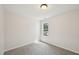 Cozy carpeted bedroom with natural light streaming through a window at 145 Richmond Park Dr, Cameron, NC 28326