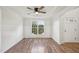 A bright dining room with hardwood floors, wainscoting and a large window at 145 Richmond Park Dr, Cameron, NC 28326