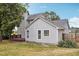 Charming home exterior with a deck, fenced yard, and beautiful landscaping at 145 Richmond Park Dr, Cameron, NC 28326