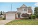 Charming two-story home with gray siding, brick accents, and a well-manicured front lawn at 145 Richmond Park Dr, Cameron, NC 28326