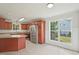 A well-lit kitchen features stainless steel appliances and spacious countertop for food preparation at 145 Richmond Park Dr, Cameron, NC 28326