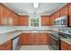 Kitchen featuring stainless steel appliances and warm wood cabinetry at 145 Richmond Park Dr, Cameron, NC 28326