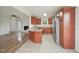 Open concept kitchen with stainless steel appliances and bar top overlooking living area at 145 Richmond Park Dr, Cameron, NC 28326
