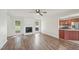 Spacious living room features a brick fireplace, hardwood floors and an open floor plan at 145 Richmond Park Dr, Cameron, NC 28326