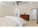 Comfortable bedroom with light walls, neutral carpeting, and ceiling fan at 192 Crestdale Dr, Clayton, NC 27520