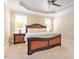 Spacious bedroom with plush carpeting, ceiling fan, and tray ceiling at 192 Crestdale Dr, Clayton, NC 27520