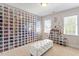 Custom closet with storage for shoes, natural light, and a tufted ottoman at 192 Crestdale Dr, Clayton, NC 27520
