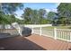 View of a wooden deck with white railings overlooking the backyard at 192 Crestdale Dr, Clayton, NC 27520
