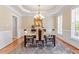 Well-lit dining room featuring crown molding, wainscotting and hardwood flooring at 192 Crestdale Dr, Clayton, NC 27520