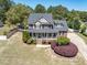 Beautiful two-story home with manicured front lawn, brick accents, covered porch, and inviting curb appeal at 192 Crestdale Dr, Clayton, NC 27520