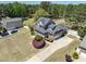 Stunning two-story home with a brick facade, covered front porch, beautiful landscaping, and a spacious lawn at 192 Crestdale Dr, Clayton, NC 27520