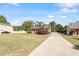 Charming two-story brick home featuring a welcoming front porch and a long driveway at 192 Crestdale Dr, Clayton, NC 27520