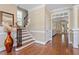 Entryway boasts hardwood floors, a staircase with iron spindles, and beautiful molding at 192 Crestdale Dr, Clayton, NC 27520