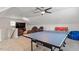 Bright game room with ping pong table, TV, and seating, ideal for recreation and relaxation at 192 Crestdale Dr, Clayton, NC 27520