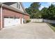 Spacious two-car garage with a concrete driveway and well-maintained landscaping at 192 Crestdale Dr, Clayton, NC 27520