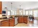 Open kitchen with granite countertops, stainless steel appliances, and breakfast bar seating at 192 Crestdale Dr, Clayton, NC 27520