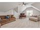 Spacious bonus room with comfortable seating, a ceiling fan, and a work station at 192 Crestdale Dr, Clayton, NC 27520