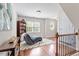 Cozy reading nook with a plush chaise lounge, bookshelf, and natural light at 192 Crestdale Dr, Clayton, NC 27520