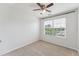 Clean bedroom with carpet, ceiling fan, and natural light from the window at 2027 Hayes Ln, Holly Springs, NC 27540