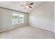 Neutral bedroom with vaulted ceiling, carpet flooring, and natural light at 2027 Hayes Ln, Holly Springs, NC 27540