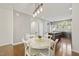 Cozy dining area adjacent to the kitchen, featuring modern lighting and a table for four at 2027 Hayes Ln, Holly Springs, NC 27540